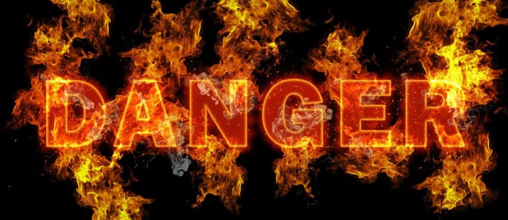 Bold lettering reading “DANGER” engulfed in flames, symbolizing the extreme risks of synthetic drug use.