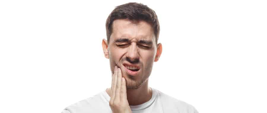 man touching cheek