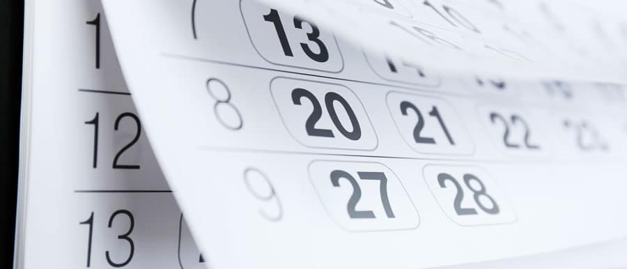 Close-up of calendar pages flipping, symbolizing the timeline and commitment needed for addiction recovery and alcohol detox programs.